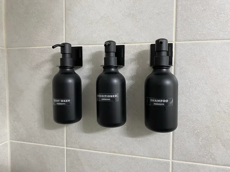 Matte black shampoo, conditioner and body wash dispensers