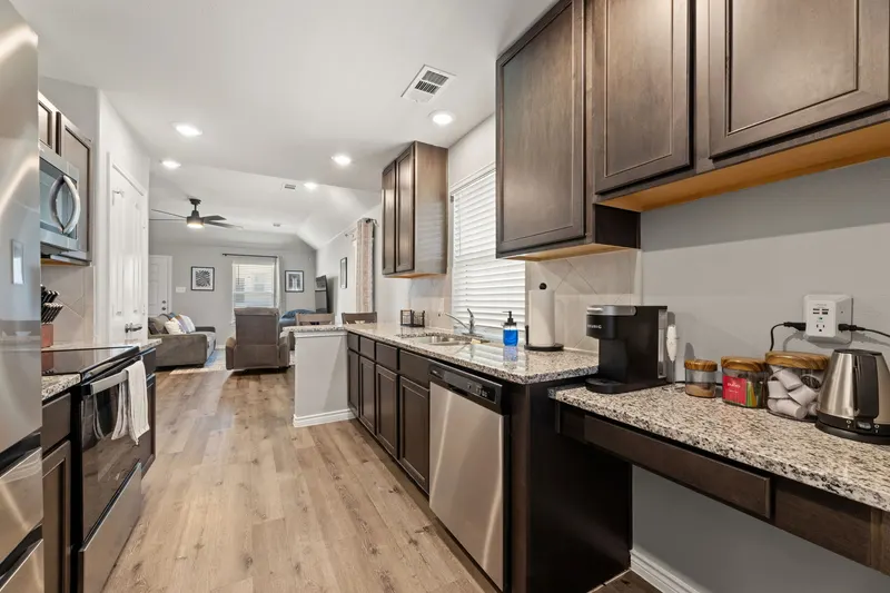Galley kitchen opening onto the living room